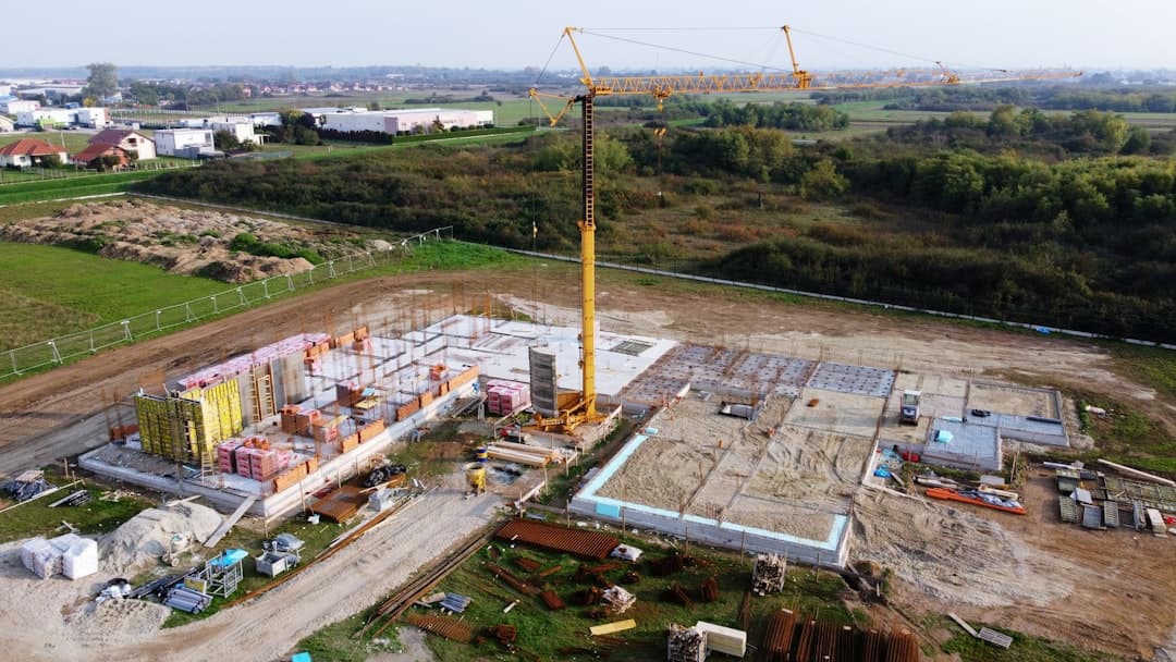 An aerial view of a construction site with a crane