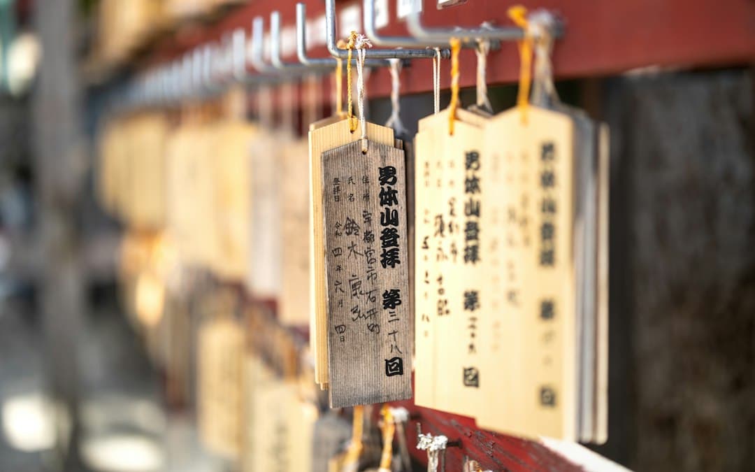 A bunch of tags are hanging on a wall