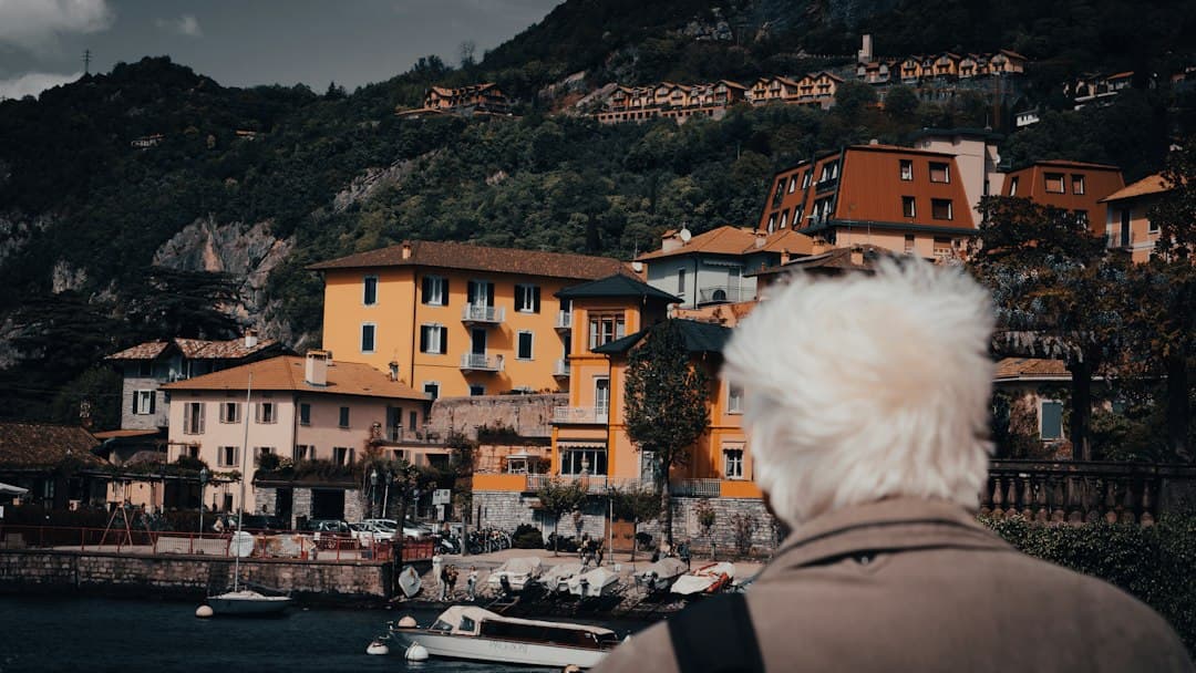 A man standing next to a body of water