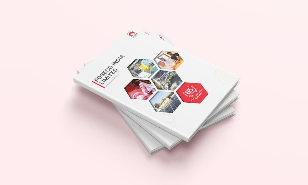 a stack of white brochures on a pink background