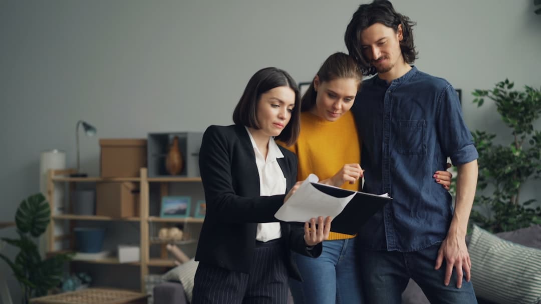 a group of people looking at a piece of paper