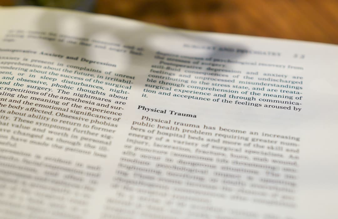 Close-up of text in a book about physical trauma.