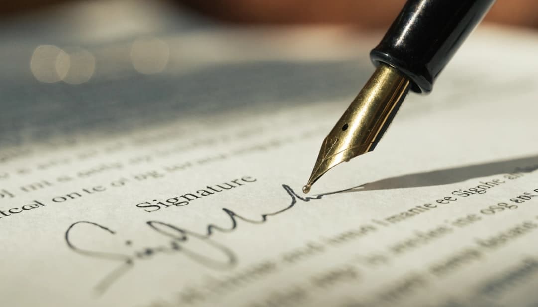 international business contract signing — photo by Naim uddin on Unsplash