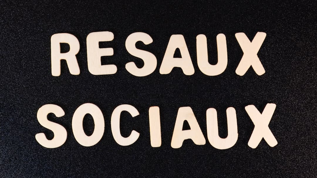 a close up of two white letters on a black surface