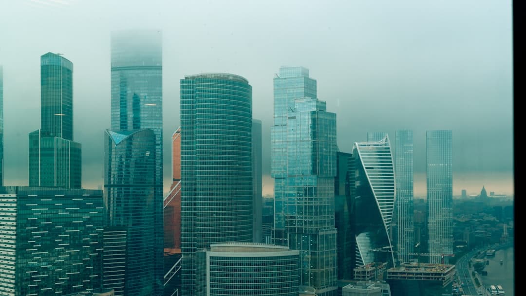 A foggy cityscape with modern skyscrapers.