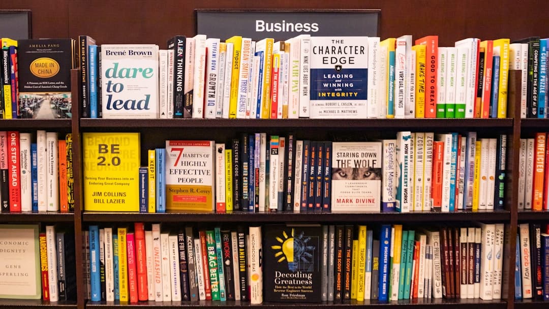 books on brown wooden shelf