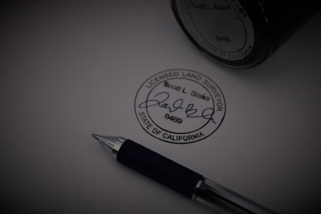 a pen sitting on top of a piece of paper
